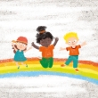 Kinder tanzen auf dem Regenbogen
