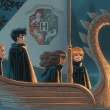 Harry, Ron und Hermine in einem Boot auf dem Weg nach Hogwarts
